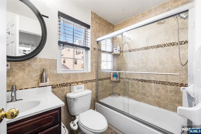a bathroom with a sink a toilet and a bathtub