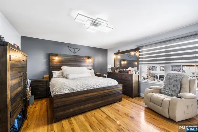 a bedroom with bed and window