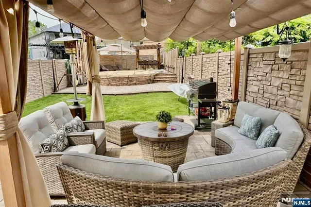 a outdoor living space with furniture and garden view