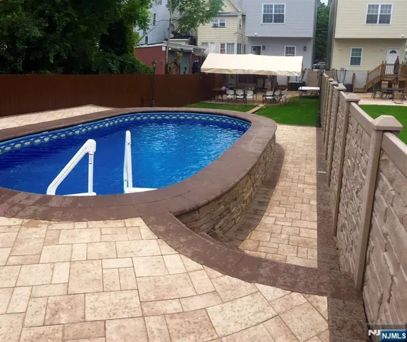 a view of swimming pool with outdoor seating