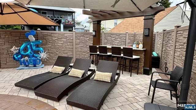 a patio with table and chairs