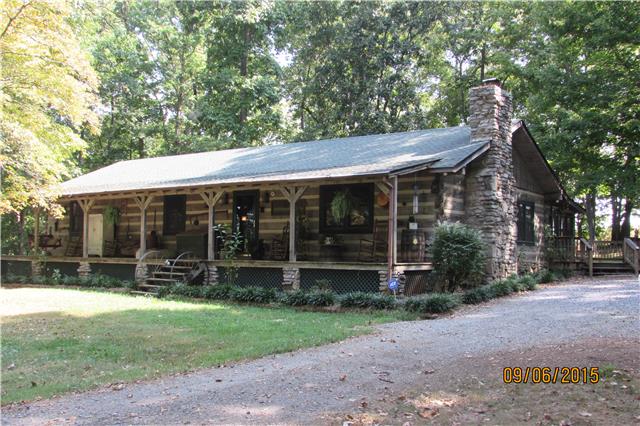 6169 Red River School Road Portland, TN 37148 - Photo 1 of 20 a front view of house with a garden
