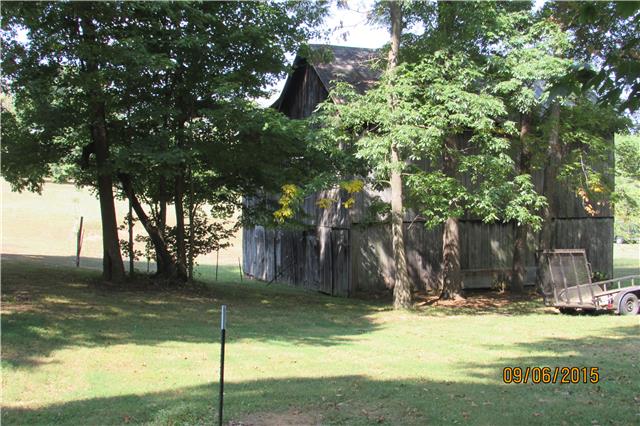 6169 Red River School Road Portland, TN 37148 - Photo 15 of 20 a view of a wooden house with a yard