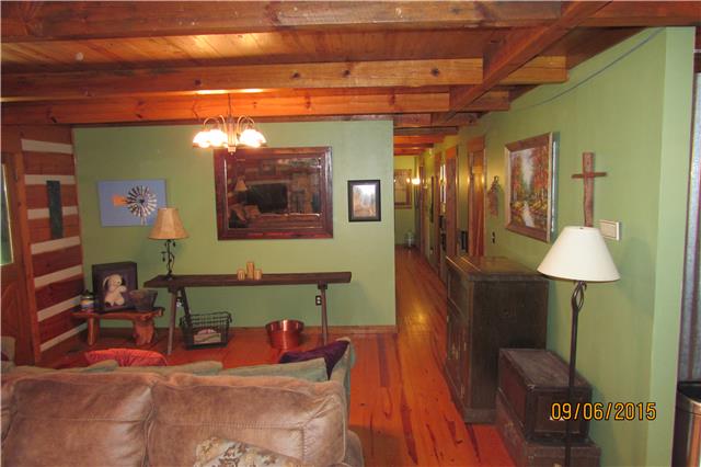 6169 Red River School Road Portland, TN 37148 - Photo 2 of 20 a living room with furniture and a chandelier