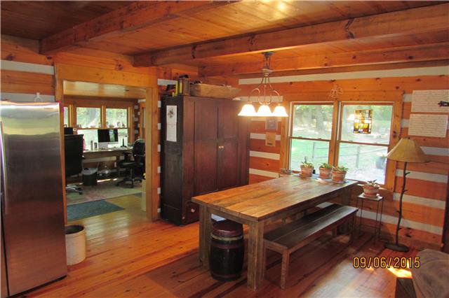 6169 Red River School Road Portland, TN 37148 - Photo 5 of 20 a view of a kitchen with dining table and chairs