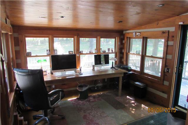 6169 Red River School Road Portland, TN 37148 - Photo 6 of 20 a view of a workspace with furniture and a window