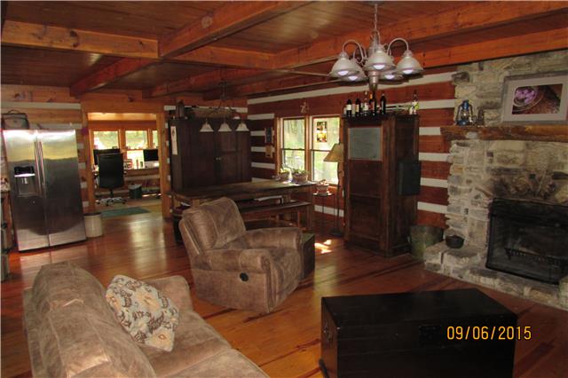 6169 Red River School Road Portland, TN 37148 - Photo 7 of 20 a living room with fireplace furniture and a chandelier