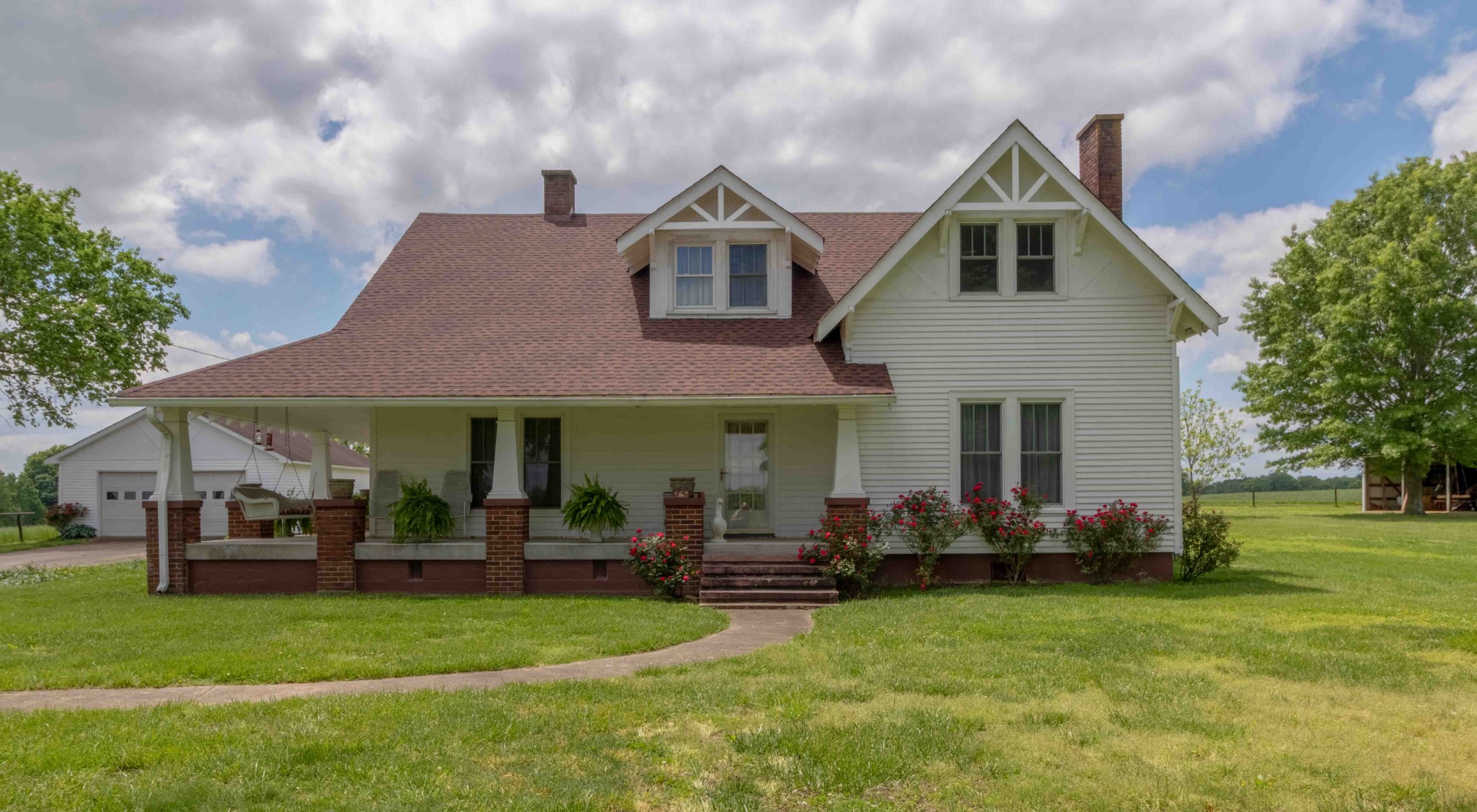 1780 Hickory Point Road Clarksville, TN 37043 - Photo 1 of 50 a front view of a house with a garden and trees
