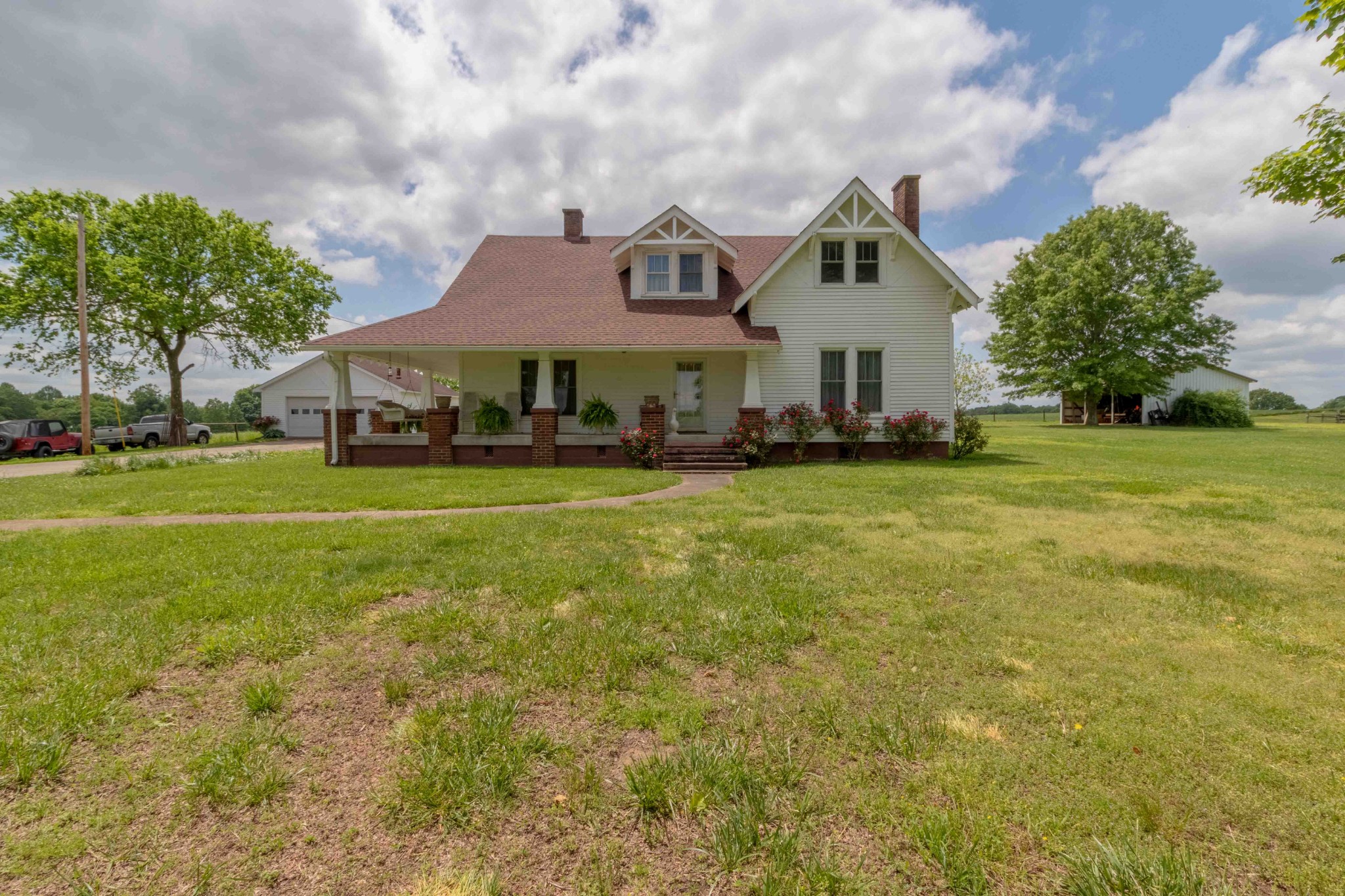 1780 Hickory Point Road Clarksville, TN 37043 - Photo 2 of 50 a view of a big house with a big yard and large trees