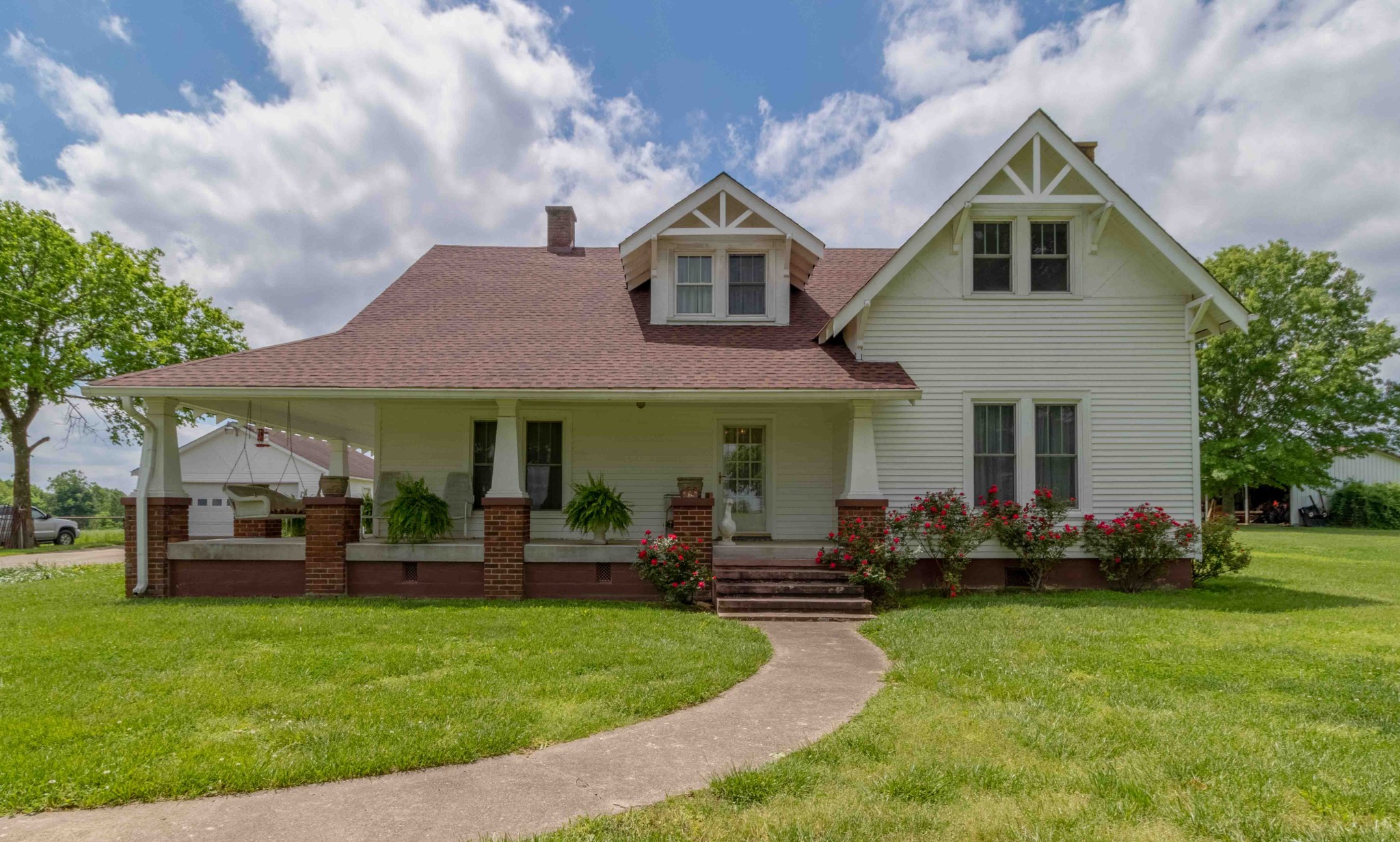 1780 Hickory Point Road Clarksville, TN 37043 - Photo 11 of 50 a front view of a house with a garden and plants