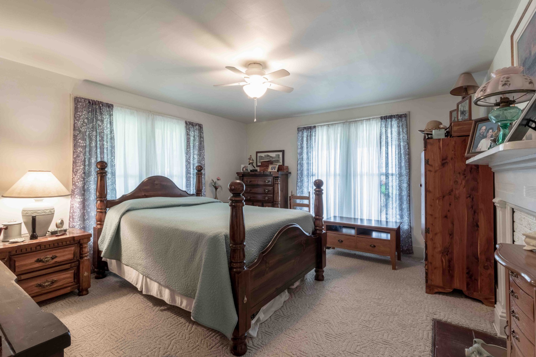 1780 Hickory Point Road Clarksville, TN 37043 - Photo 31 of 50 a bedroom with a bed and a chandelier
