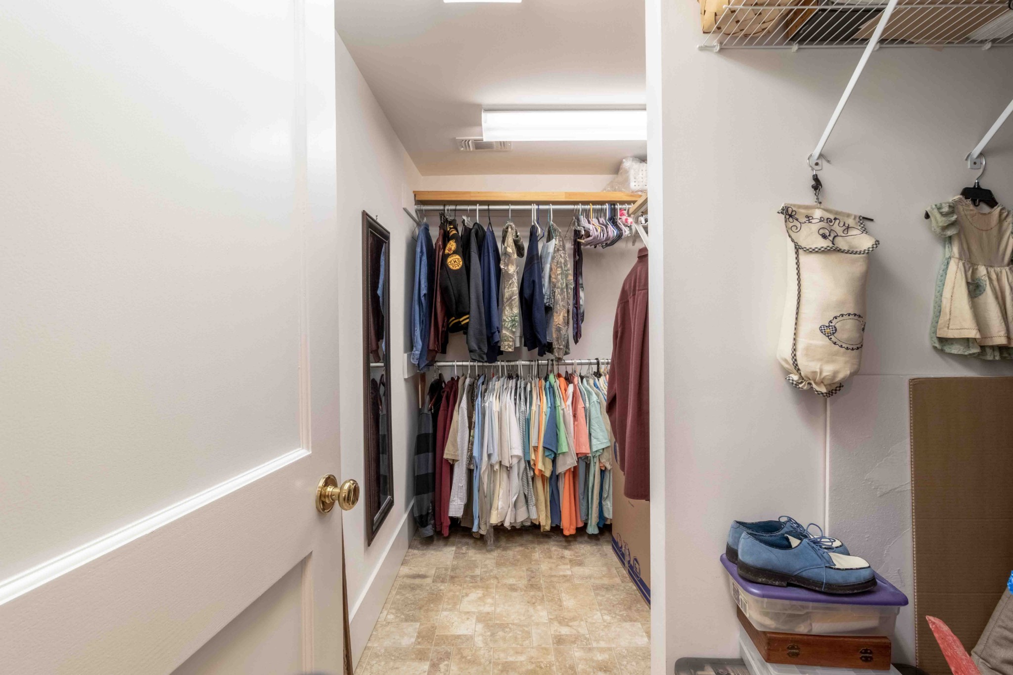 1780 Hickory Point Road Clarksville, TN 37043 - Photo 38 of 50 a view of walk in closet with clothes and shoes