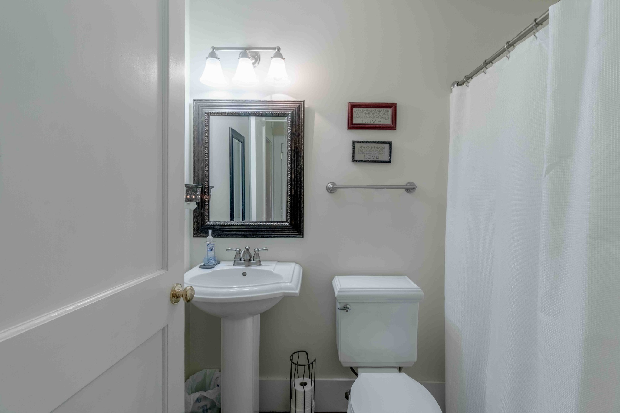 1780 Hickory Point Road Clarksville, TN 37043 - Photo 40 of 50 a bathroom with a toilet sink and mirror