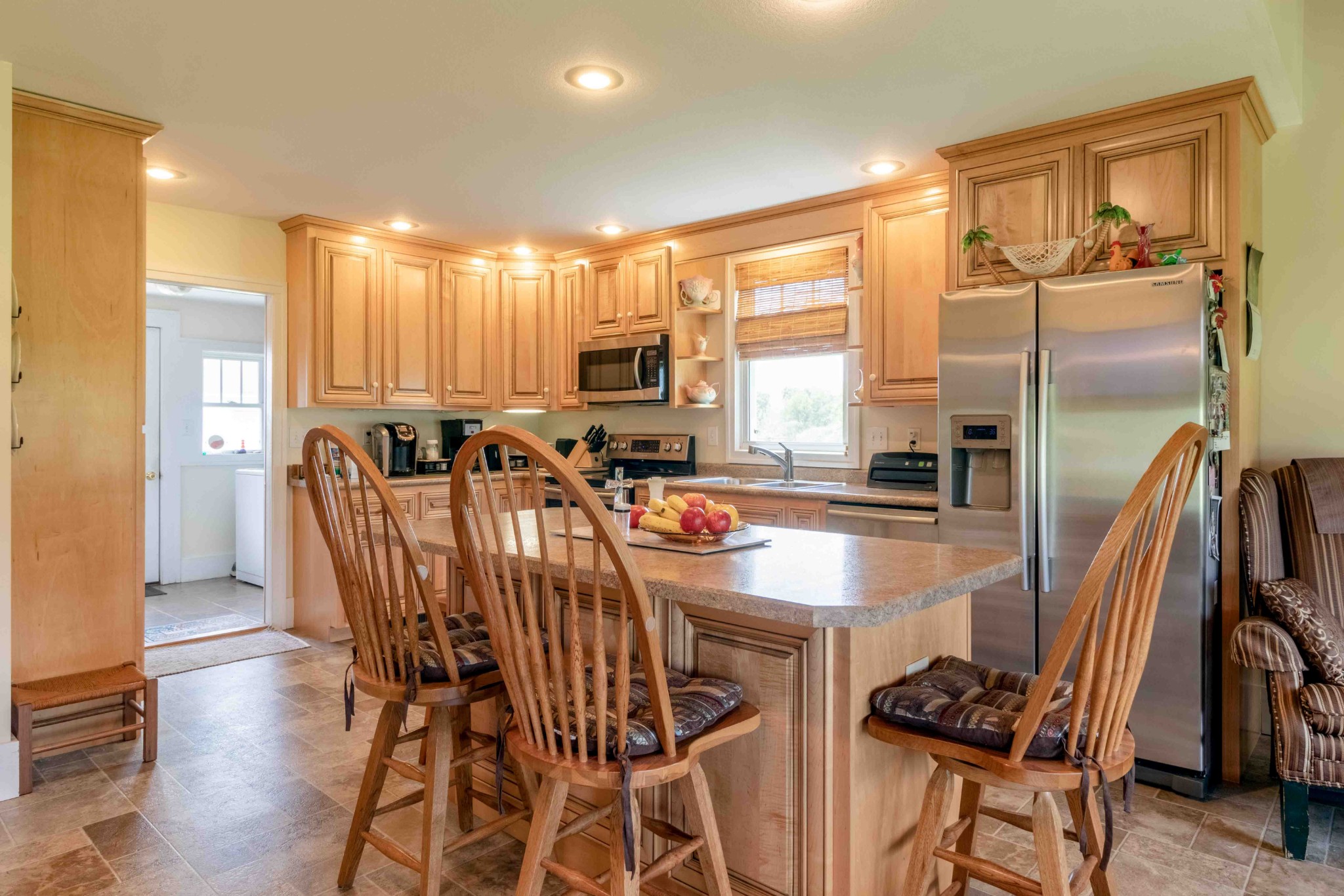 1780 Hickory Point Road Clarksville, TN 37043 - Photo 43 of 50 a kitchen with stainless steel appliances granite countertop a refrigerator a stove a sink a dining table and chairs with wooden floor