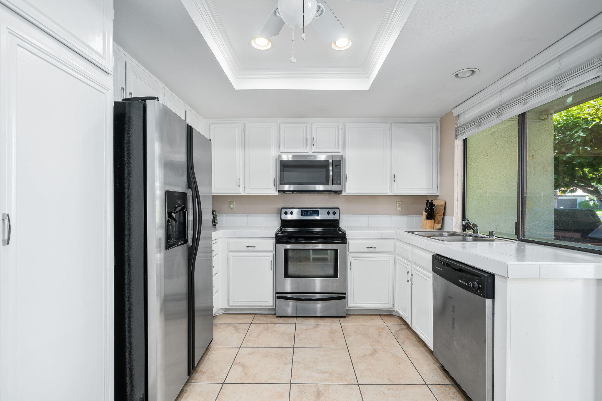 28 Palomas Drive Rancho Mirage, CA 92270 - Photo 13 of 26 a kitchen with a stove sink and refrigerator