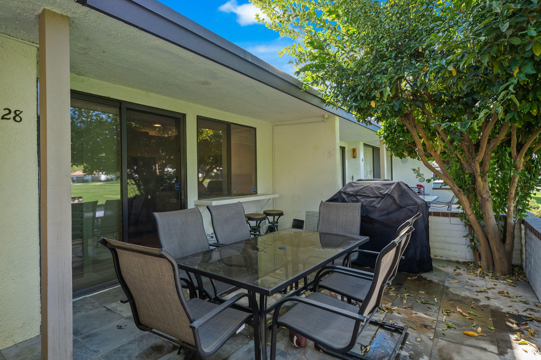 28 Palomas Drive Rancho Mirage, CA 92270 - Photo 15 of 26 a backyard of a house with table and chairs