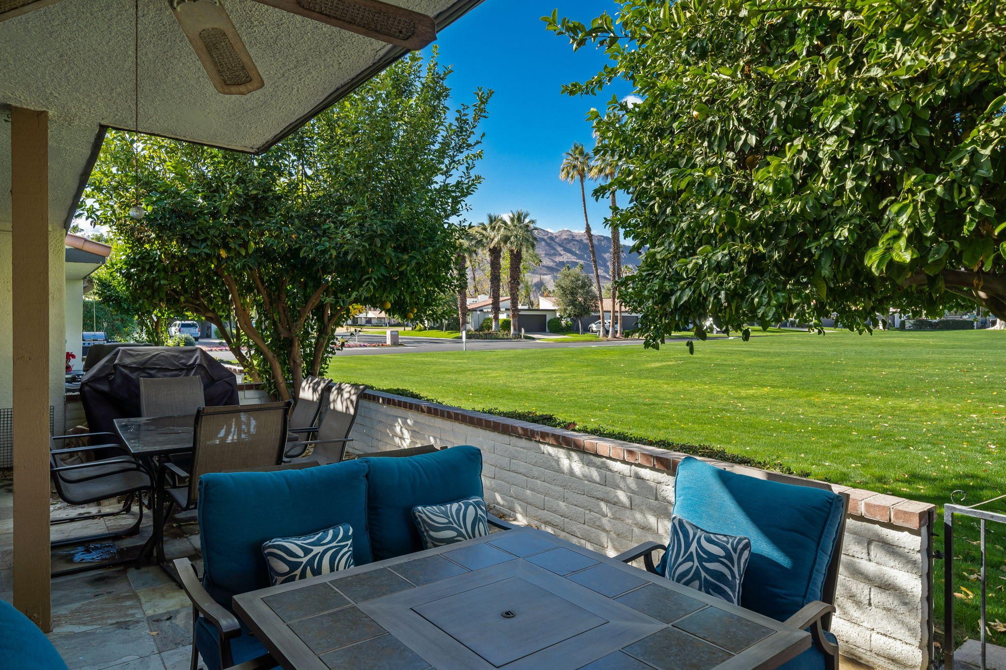 28 Palomas Drive Rancho Mirage, CA 92270 - Photo 18 of 26 a view of a chairs and table in the garden
