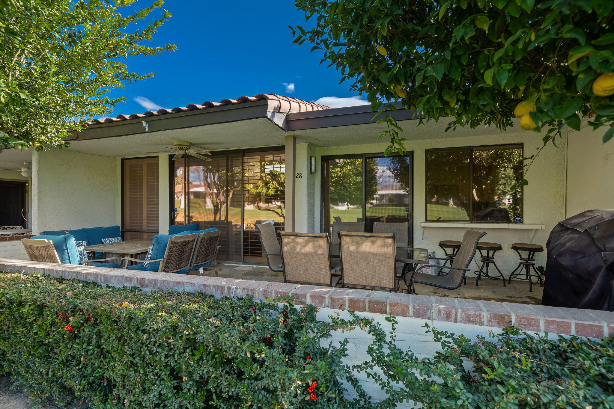 28 Palomas Drive Rancho Mirage, CA 92270 - Photo 19 of 26 a front view of a house with outdoor seating