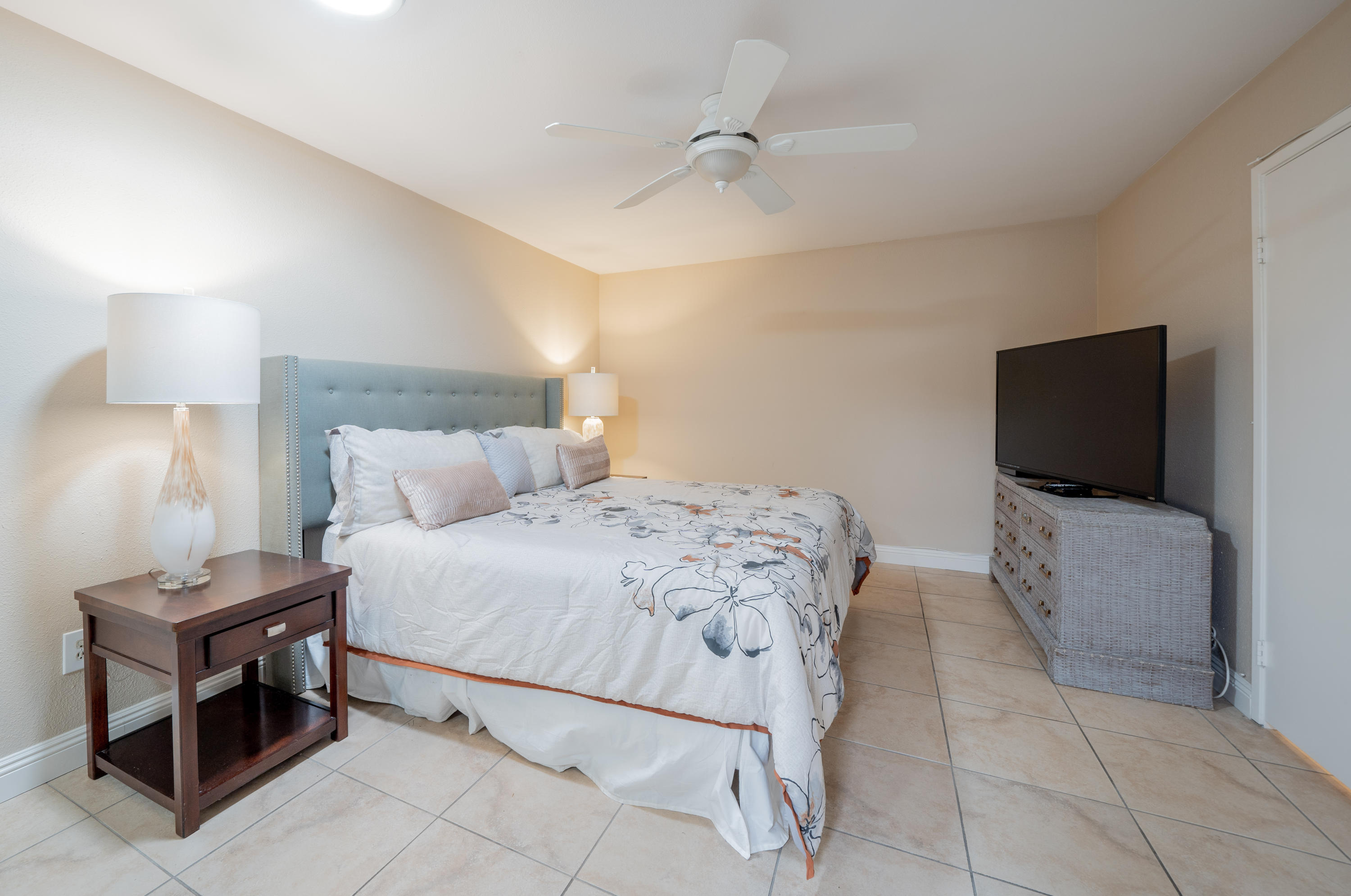 28 Palomas Drive Rancho Mirage, CA 92270 - Photo 21 of 26 a bedroom with a bed and a flat screen tv