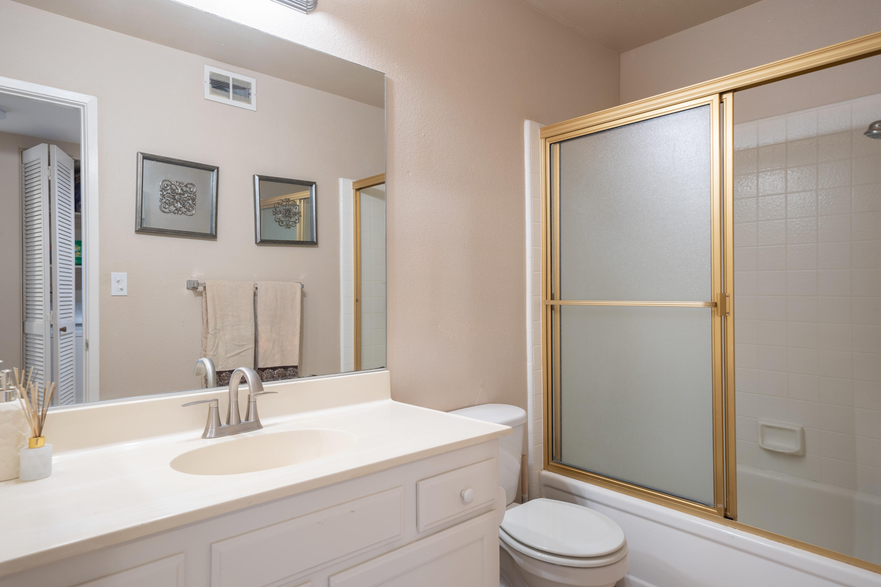 28 Palomas Drive Rancho Mirage, CA 92270 - Photo 23 of 26 a bathroom with a sink a toilet and shower