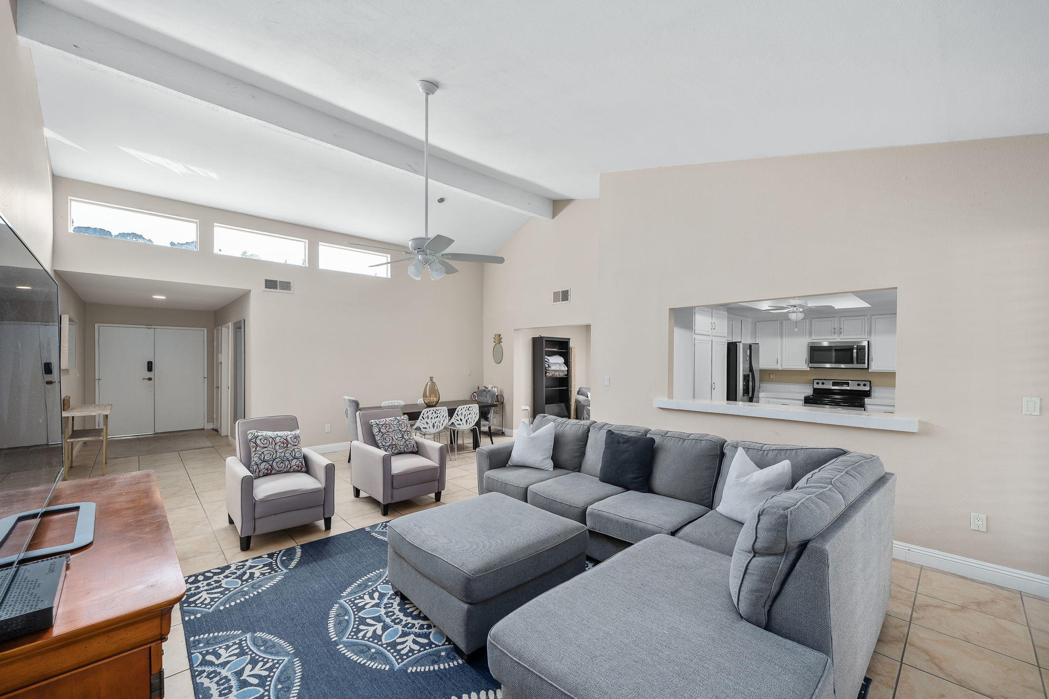 28 Palomas Drive Rancho Mirage, CA 92270 - Photo 8 of 26 a living room with furniture and a chandelier