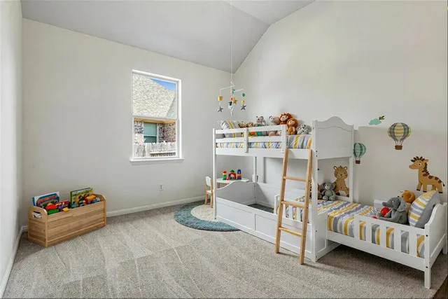 a bedroom with bed and a window