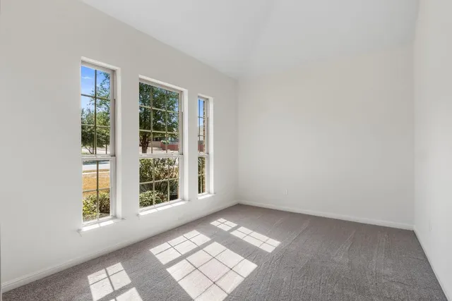 an empty room with windows