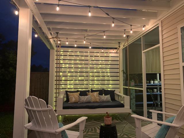 201 Saxony Loop Summerville, SC 29486 - Photo 10 of 58 Porch swing at night