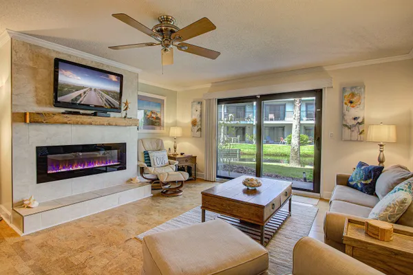 a living room with furniture and a fireplace