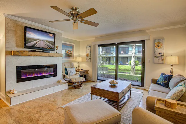 a living room with furniture and a fireplace