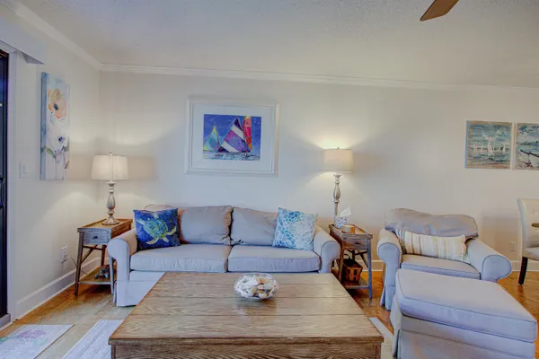 a living room with furniture fireplace and a window