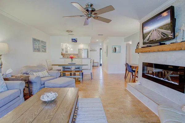 a room with wooden floor and breakfast area