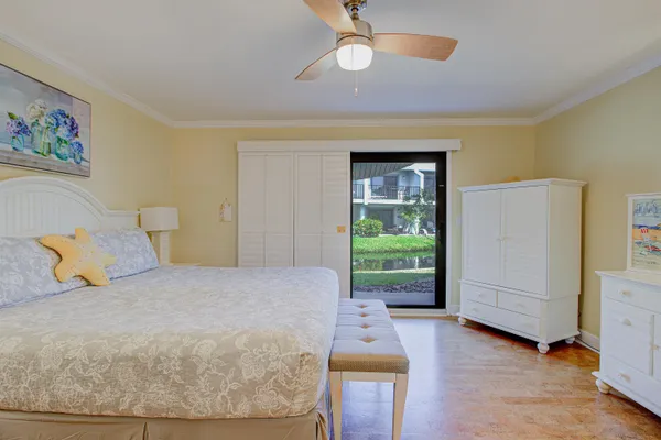 a bedroom with a bed and a mirror