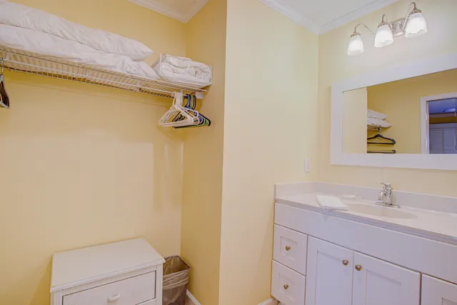 a bedroom with a bed and a lamp