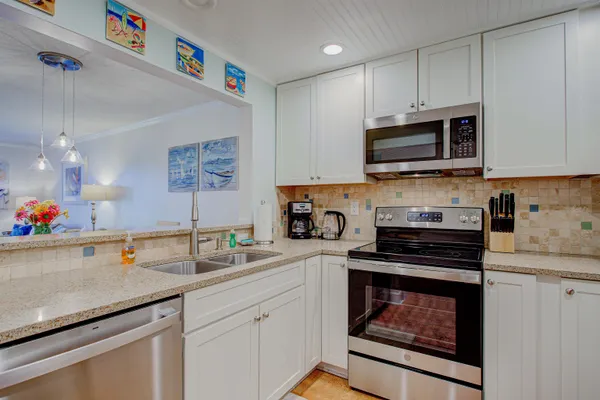 a view of a dining room with furniture and a table