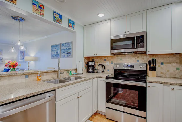 a view of a dining room with furniture and a table