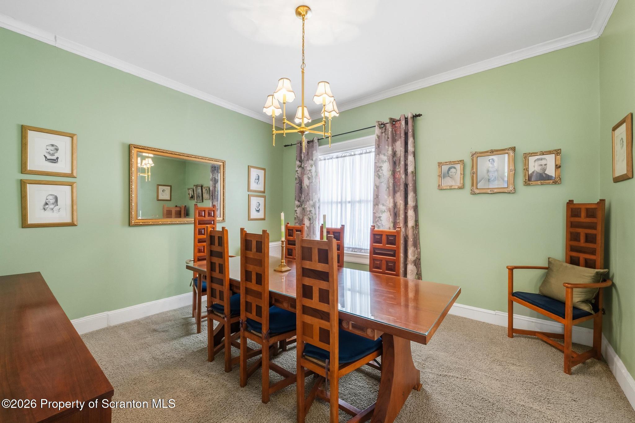 616 Myrtle Street Scranton, PA 18510 - Photo 13 of 65 a view of a dining room with furniture and a chandelier