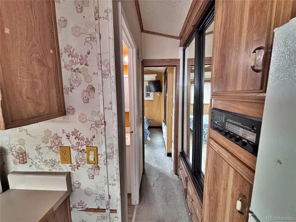 a kitchen with a stove and a refrigerator