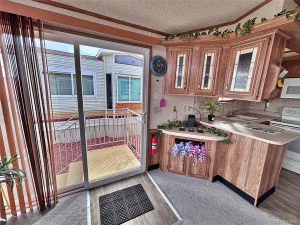 a view of front door with balcony