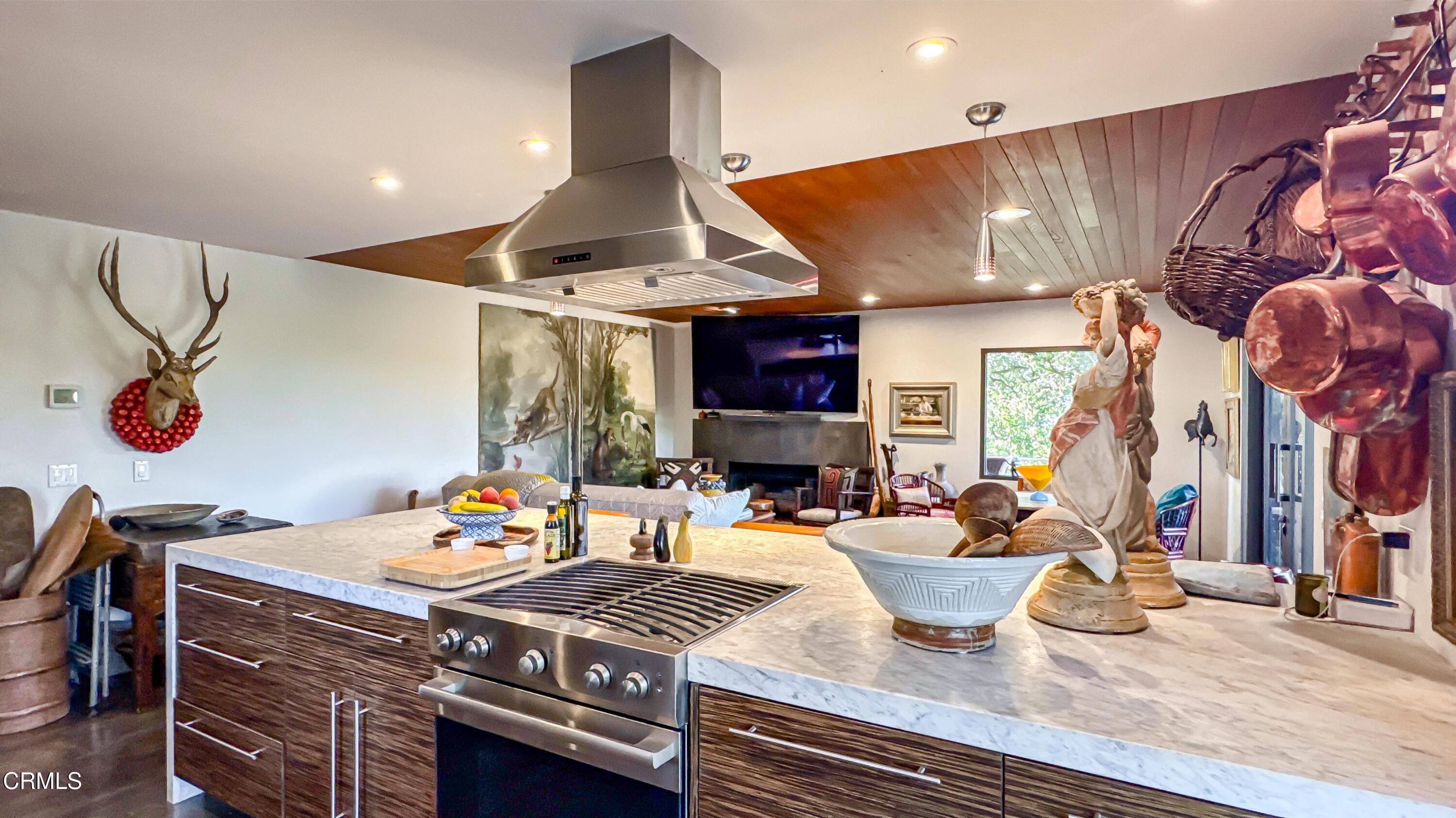 1344 Marianna Road Pasadena, CA 91105 - Photo 13 of 38 a kitchen with a stove and a wooden floor