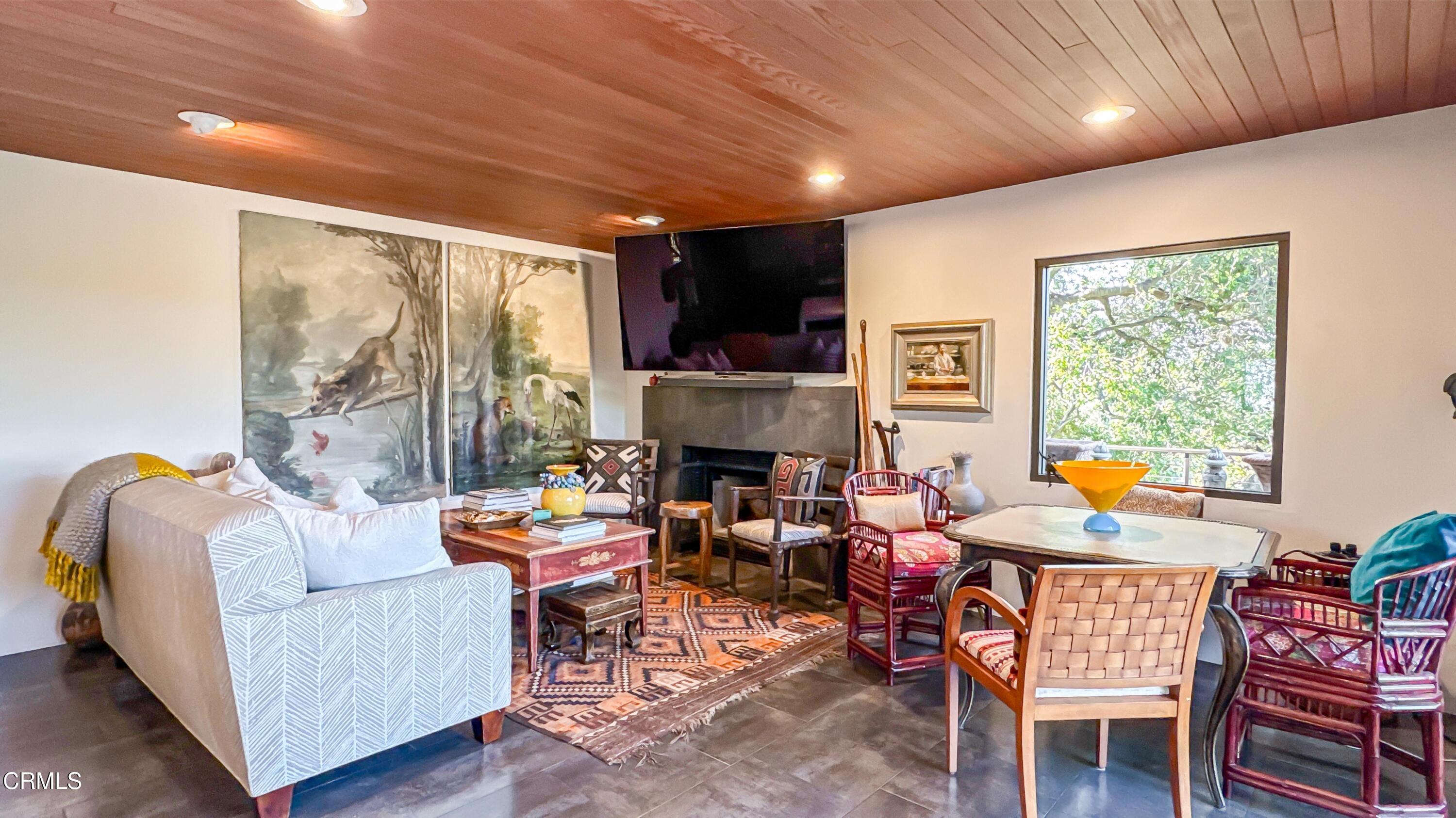 1344 Marianna Road Pasadena, CA 91105 - Photo 15 of 38 a living room with fireplace furniture and a large window