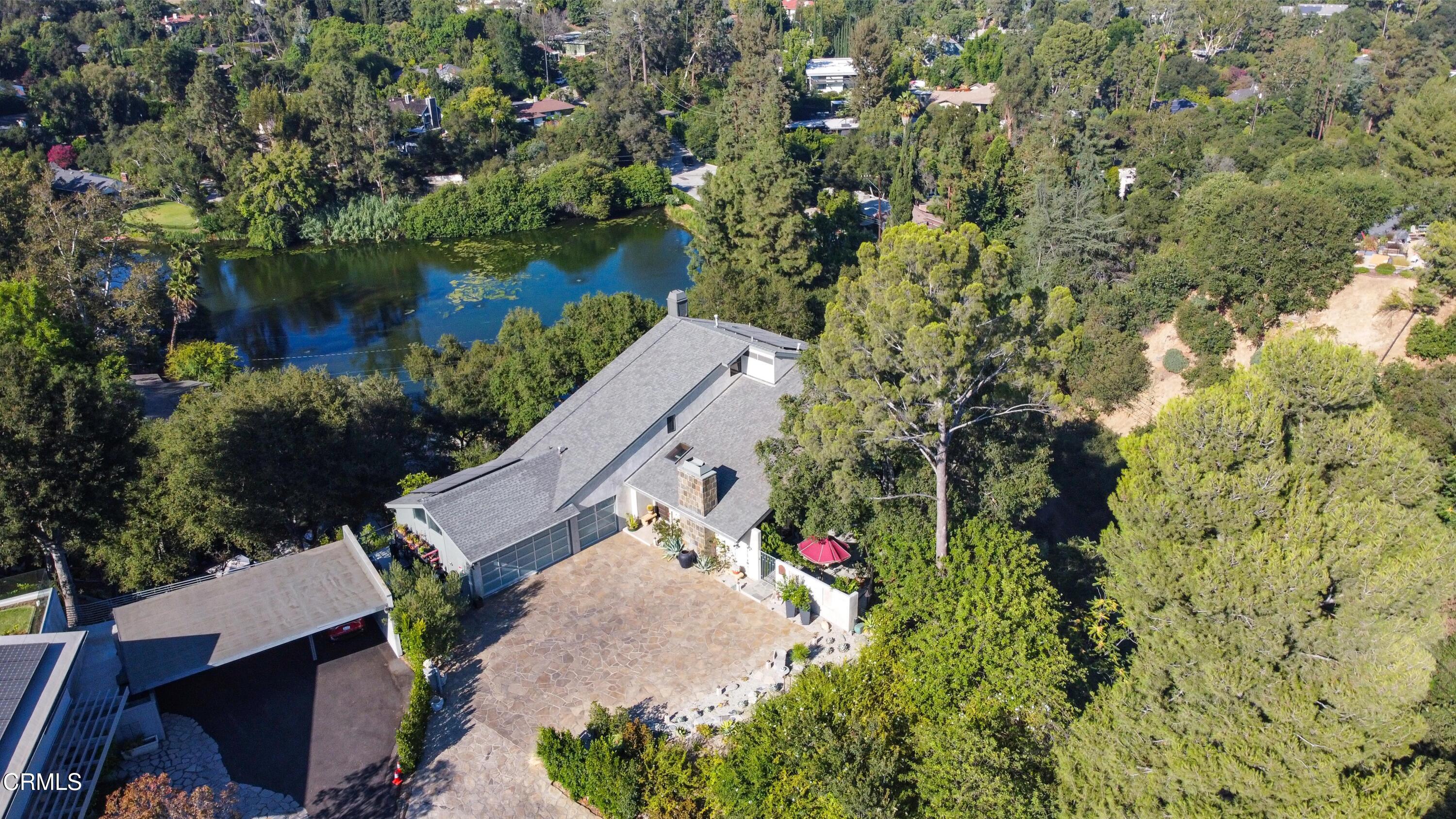 1344 Marianna Road Pasadena, CA 91105 - Photo 2 of 38 an aerial view of a house with a yard and lake view