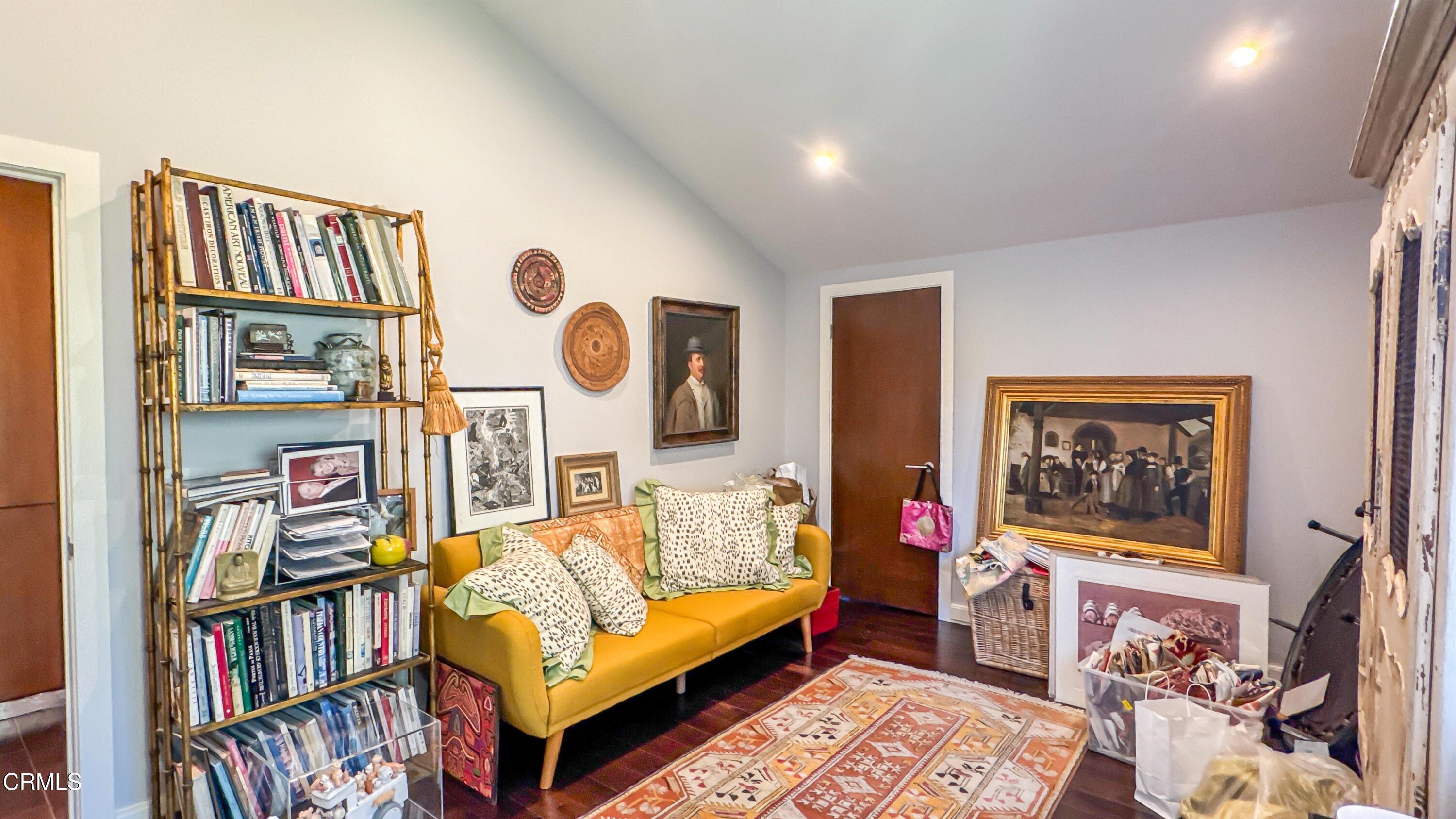 1344 Marianna Road Pasadena, CA 91105 - Photo 24 of 38 a living room with furniture and a book shelf
