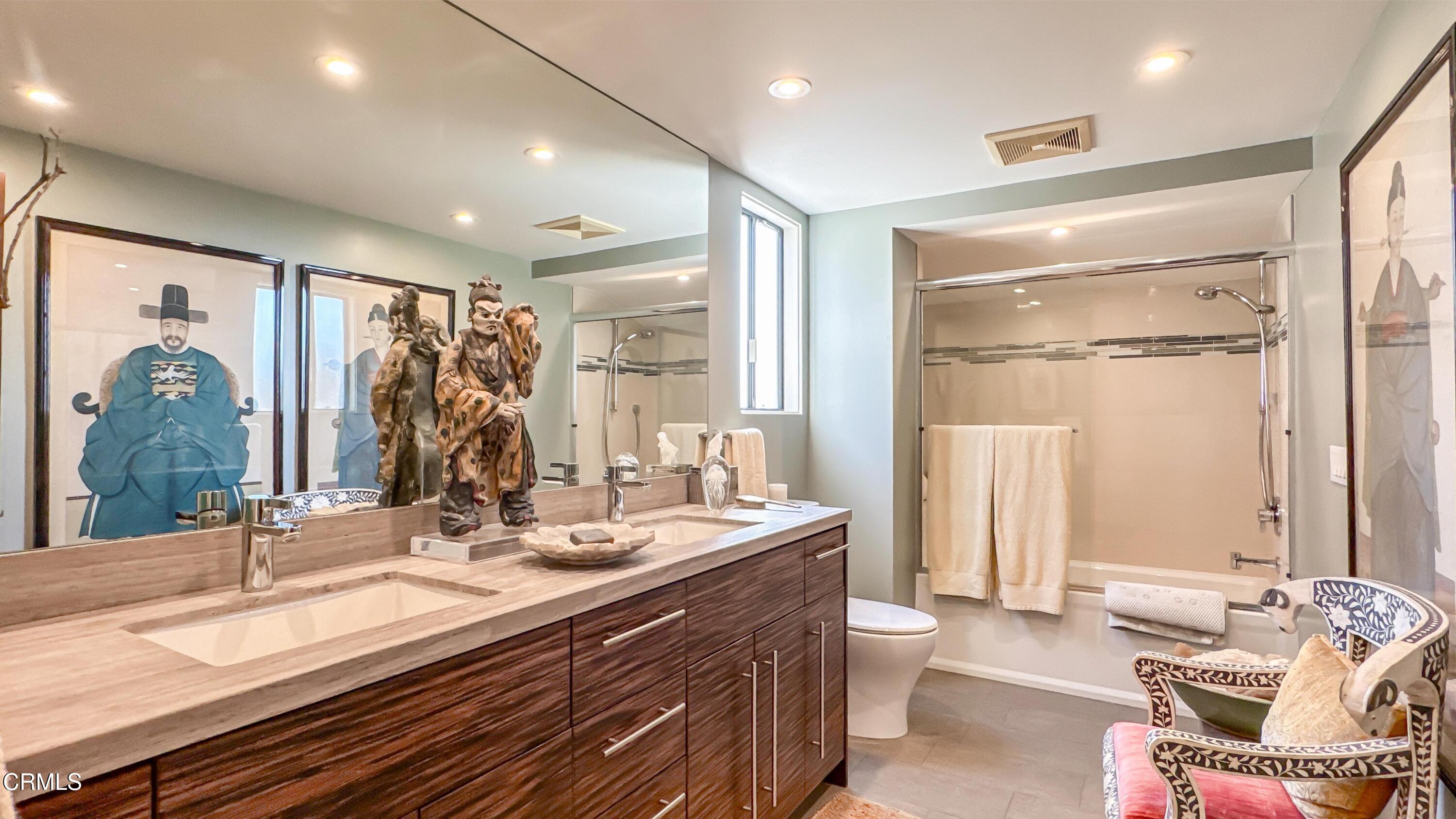 1344 Marianna Road Pasadena, CA 91105 - Photo 25 of 38 a bathroom with a double vanity sink toilet and a mirror