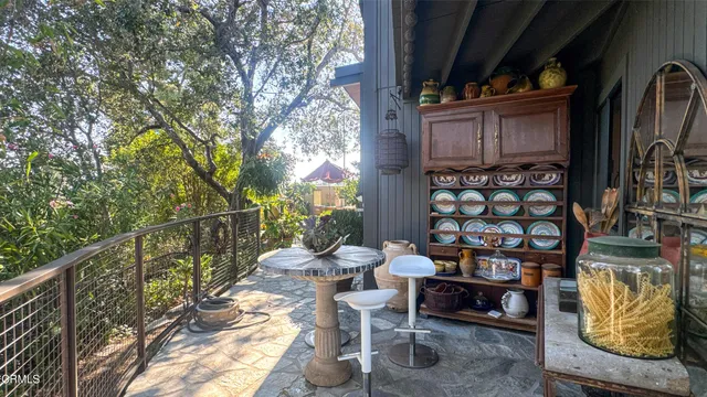 a view of a house with a tree