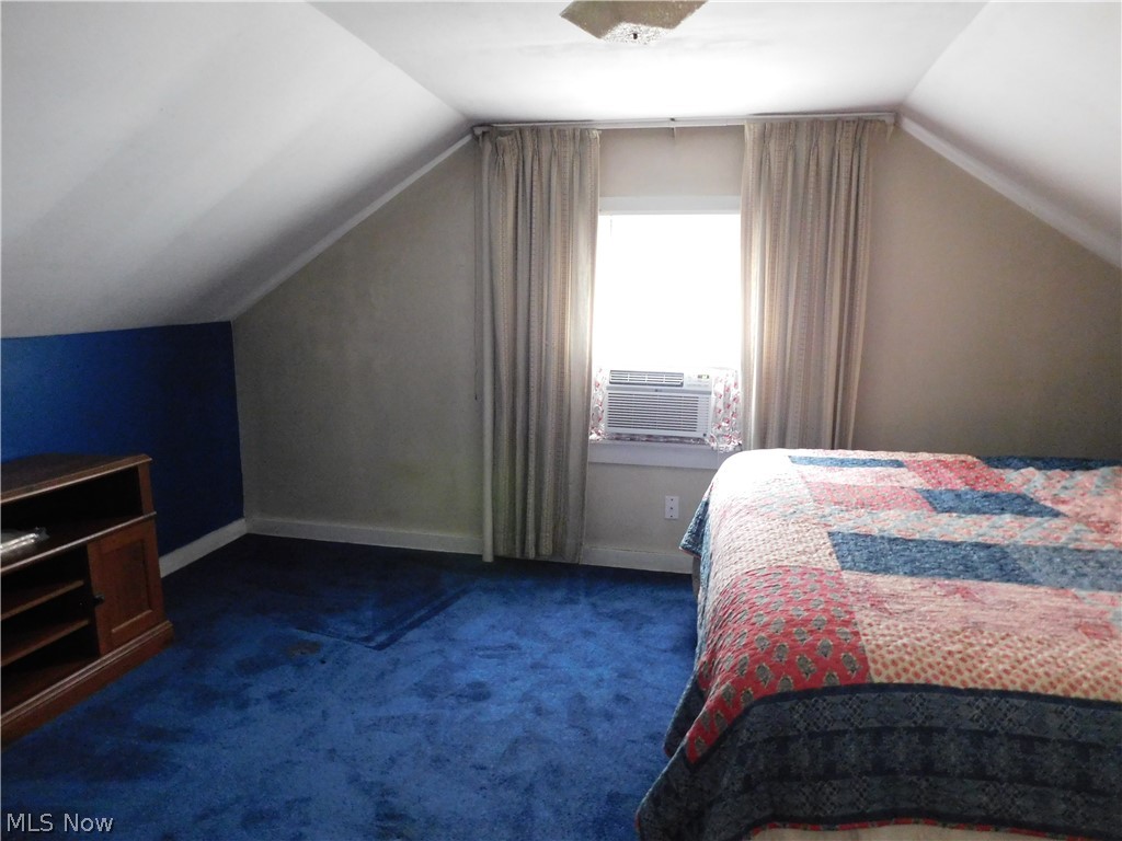 5531 Overton Road Wooster, OH 44691 - Photo 29 of 40 Carpeted bedroom featuring lofted ceiling and cooling unit