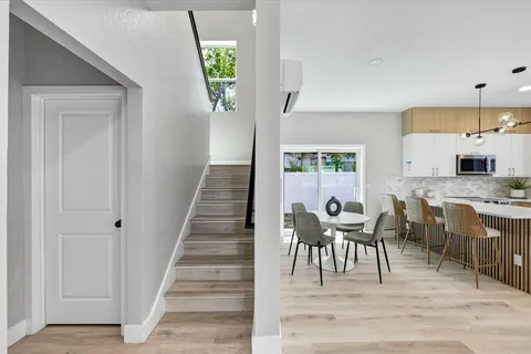 a view of dining room with furniture and wooden floor