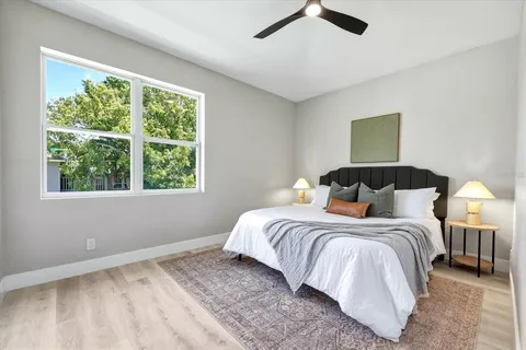 a bedroom with a bed and a window