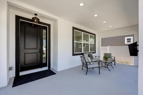 a living room with furniture and a window