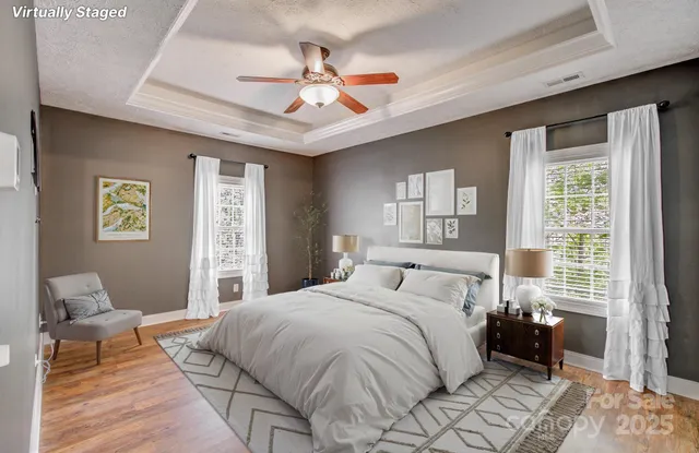 a bedroom with a large bed and a window